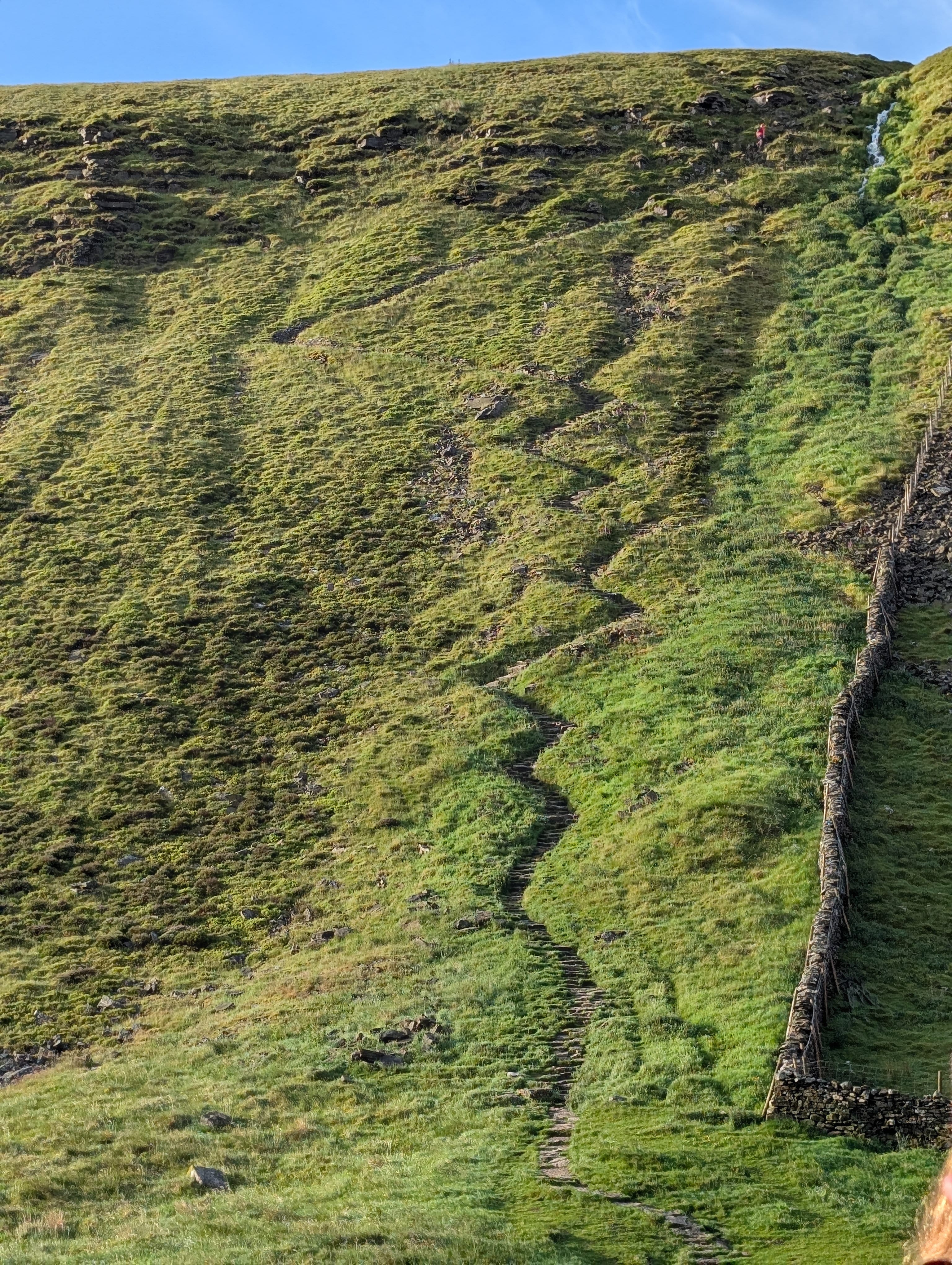 A zig-zag path up the steep slope of Ingleborough, the first peak on the trail