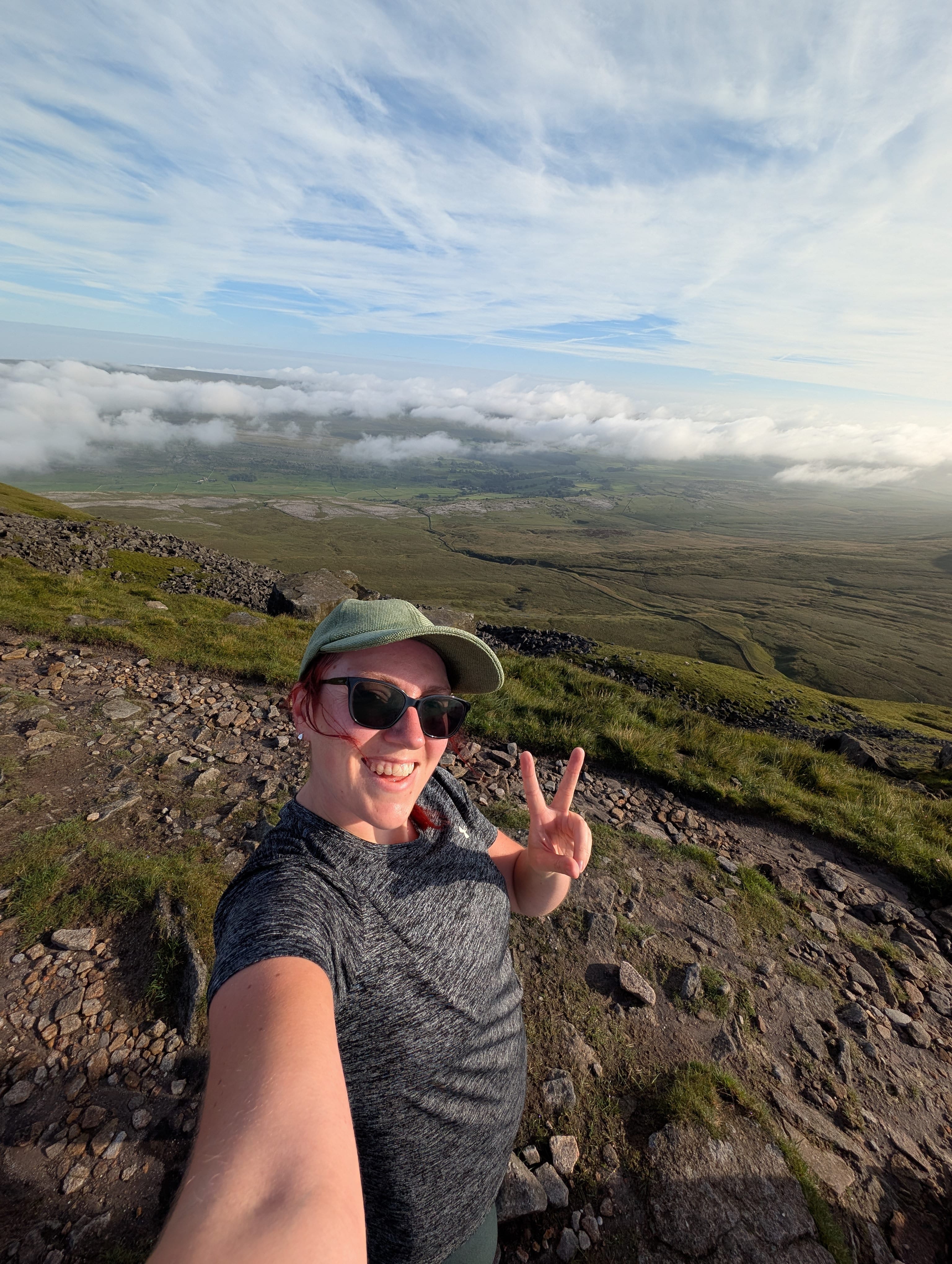 Reaching the summit of Ingleborough, 723m